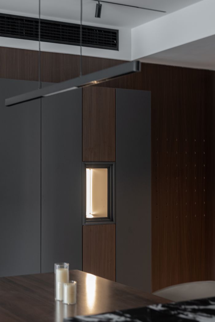 home-services-02 Modern interior with warm lighting, featuring wood and neutral tones.